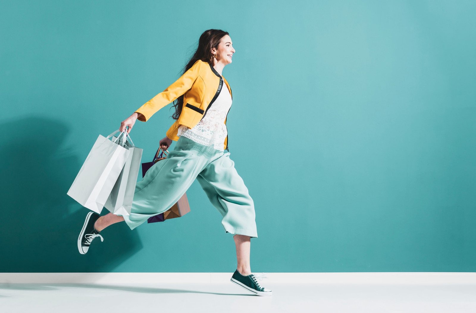Cheerful happy woman enjoying shopping